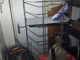 a metal rack with a lot of items on it