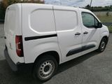 a white van that is parked in the parking lot