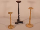 three candles that are sitting on a table
