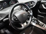 the interior of a car with a steering wheel and dashboard controls