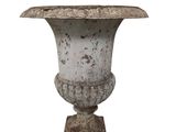 a white vase that is sitting on top of a table