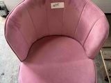 a pink chair that has a price tag on it