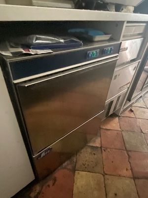 a kitchen with a stove and a dishwasher in it