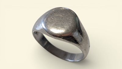 an image of a silver ring with a stone in the middle