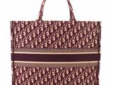 a brown and white tote bag with elephants on it