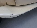 a close up of a car door handle with a hole in it