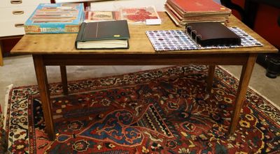 a table with a lot of books on top of it