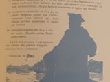 an open book with a picture of a man sitting on a bench