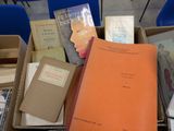 many books that are in a box on the table