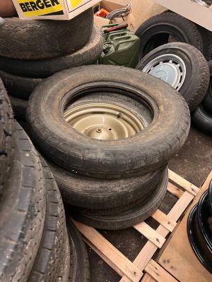 a pile of tires and a box of tires on a pallet