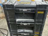 a stack of tool boxes sitting on the ground