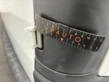 a close up of a measuring tape on the side of a vehicle