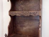 a wooden shelf that has a shelf on it