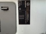 a close up of a car door with a button on it