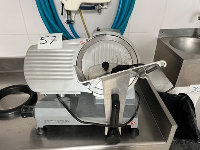 an image of a commercial meat slicer in a kitchen