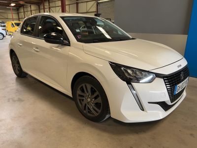 a white car parked in a garage with other cars in the background