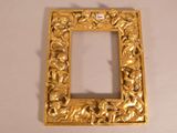 a picture of a gold picture frame on a table