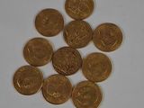 a lot of coins sitting on a white surface