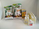 a white counter top with a lot of bottles of liquid and a bag of food