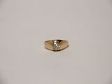 a close up of a gold ring with a diamond on it