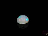 a white oplite in the dark with a black background