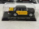 a black and yellow model of a car in a glass case