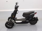 a scooter that is sitting on the floor in a room