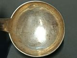 a silver cup that is sitting on a table
