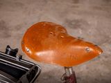 a bike that has a saddle on the back of it