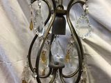 a small chandelier hanging from the ceiling in a room