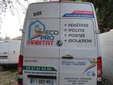 a white van that is parked in the yard