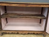a wooden shelf that has a shelf on top of it