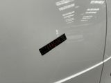 a sticker on the door of a white car