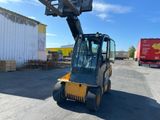 a picture of a forklift parked in a parking lot