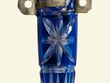 a blue glass vase with a star design on it