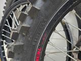 a close up of a motorcycle tire with a tire sticker on it