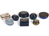 many different types of boxes and containers on a white surface