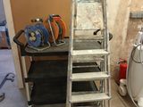 a ladder that is leaning against a wall in a room