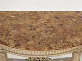 a table with a marble top on a white background