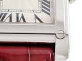 a close up of a watch with roman numerals on the face