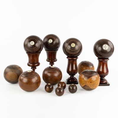 many different types of wooden knobs on a white background