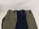 a pair of men ' s shorts laying on top of each other