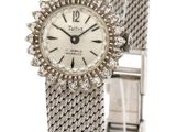 a close up of a wrist watch on a white background