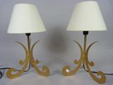 pair of brass table lamps with white lampshads and a white shade