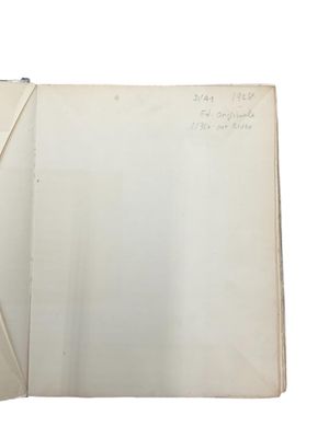 an open book with writing on it sitting on top of a table