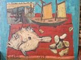 un tableau représentant un poisson et un bateau posé sur une table