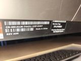 a keyboard and a mouse on a desk with a barcode on it