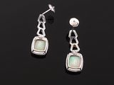 pair of silver and opalite earrings on a black surface