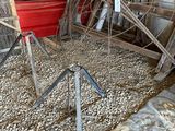 a pile of old metal and wood items in a shed