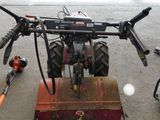 a tractor that is parked in a garage